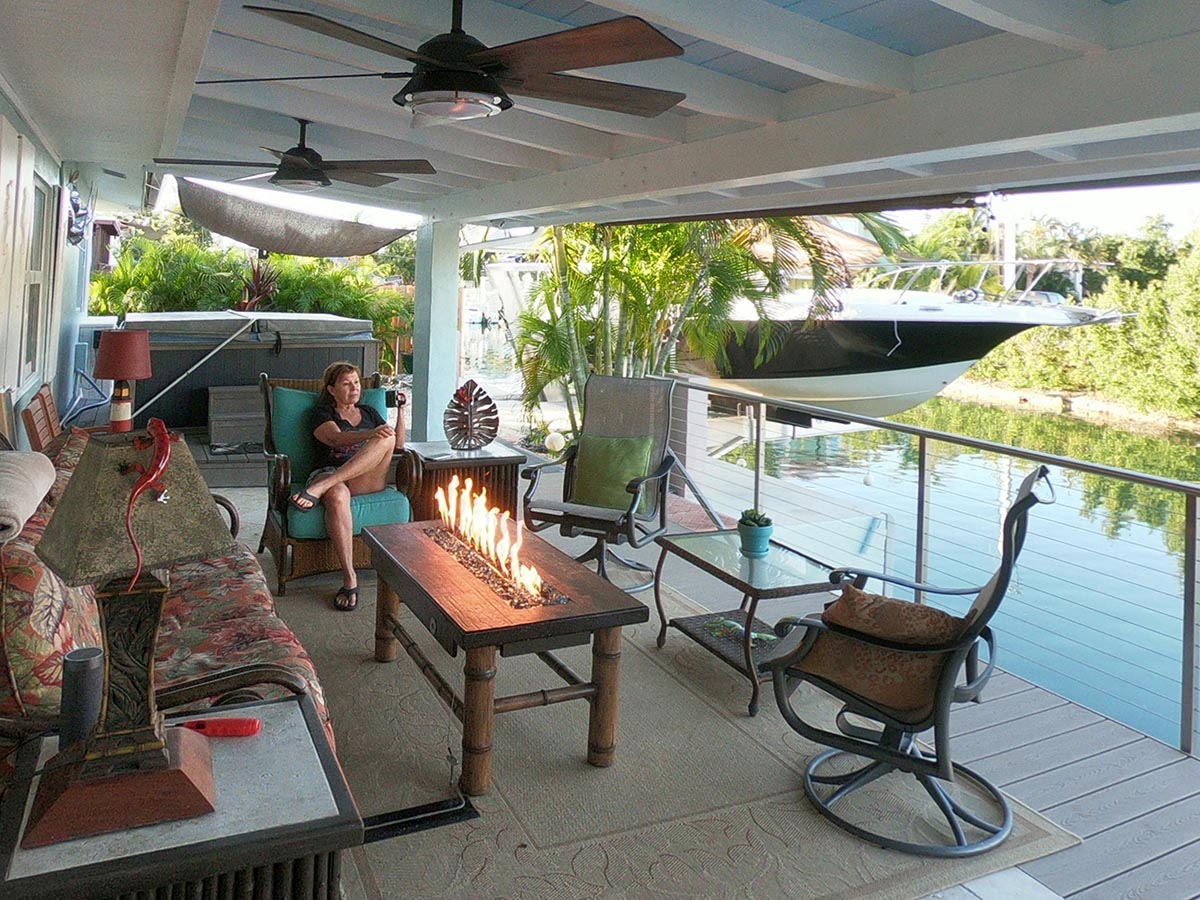Outdoor Living Room includes two lamps, fire table, fans and a private view, 10' from the water